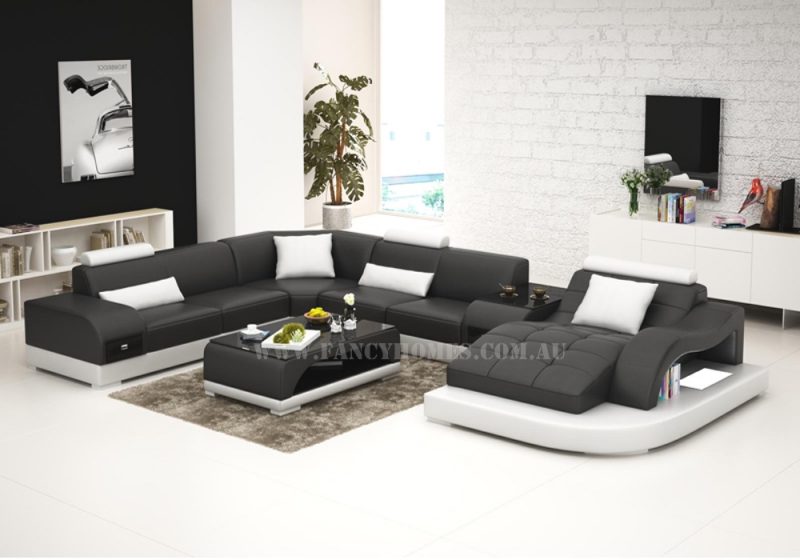 Fancy Homes Aura modular leather sofa in black and white leather featuring curved chaise, middle table, storage armrests, LED lighting system and adjustable headrests